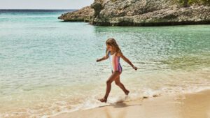 child playing on beach