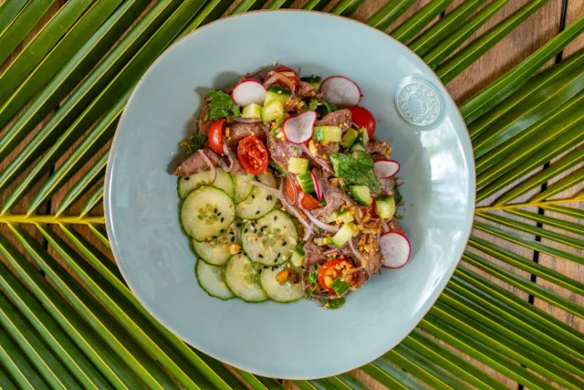 Savor every bite of this zesty Thai beef salad with ocean views and beach vibes. Fresh, flavorful, and totally unforgettable. 

#LeonsatMeadsBay #Malliouhana #Anguilla